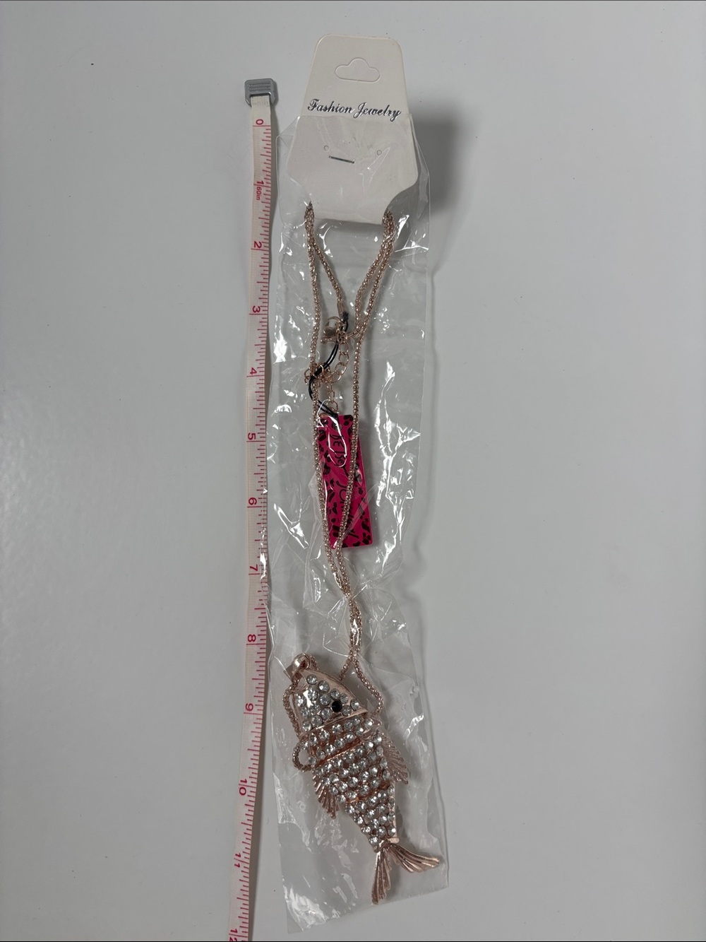 Betsey Johnson rose gold-tone fish pendant necklace with pink tag